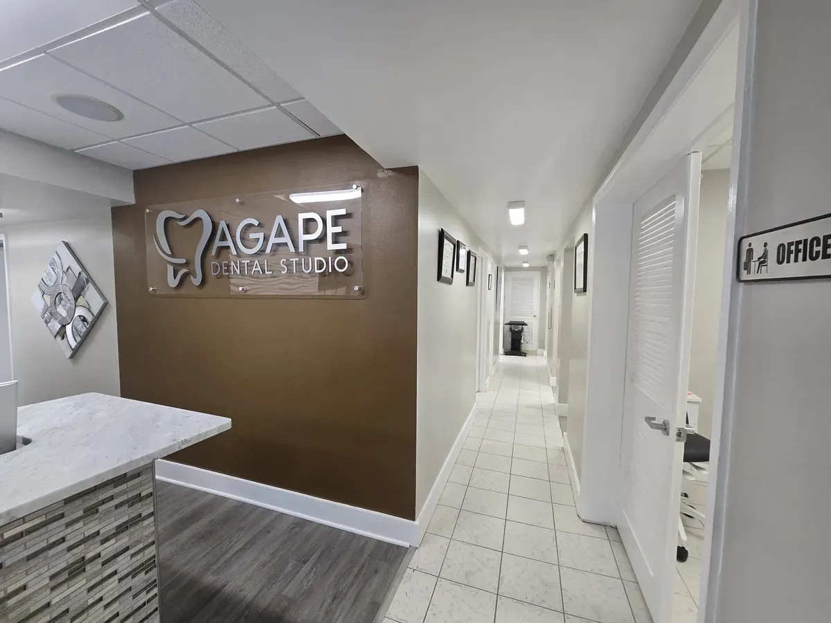 Front desk and reception area with Agape Dental Studio sign