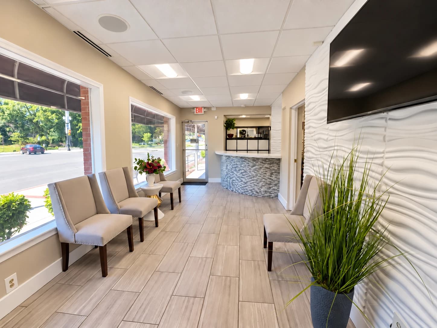 Bright waiting area with comfortable seating inside Agape Dental Studio